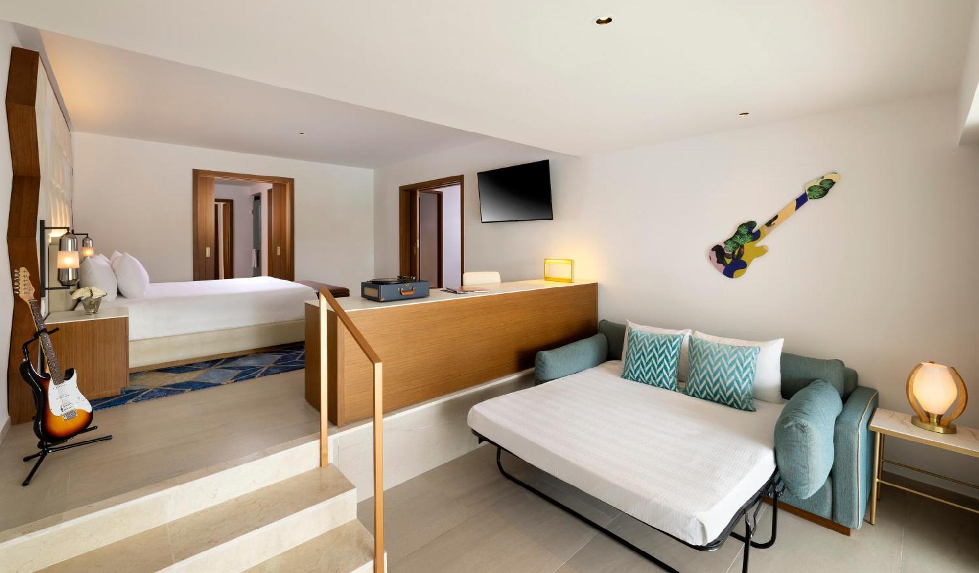 Suite Rock con 1 dormitorio, cama extragrande, sofá cama y asistente personal
