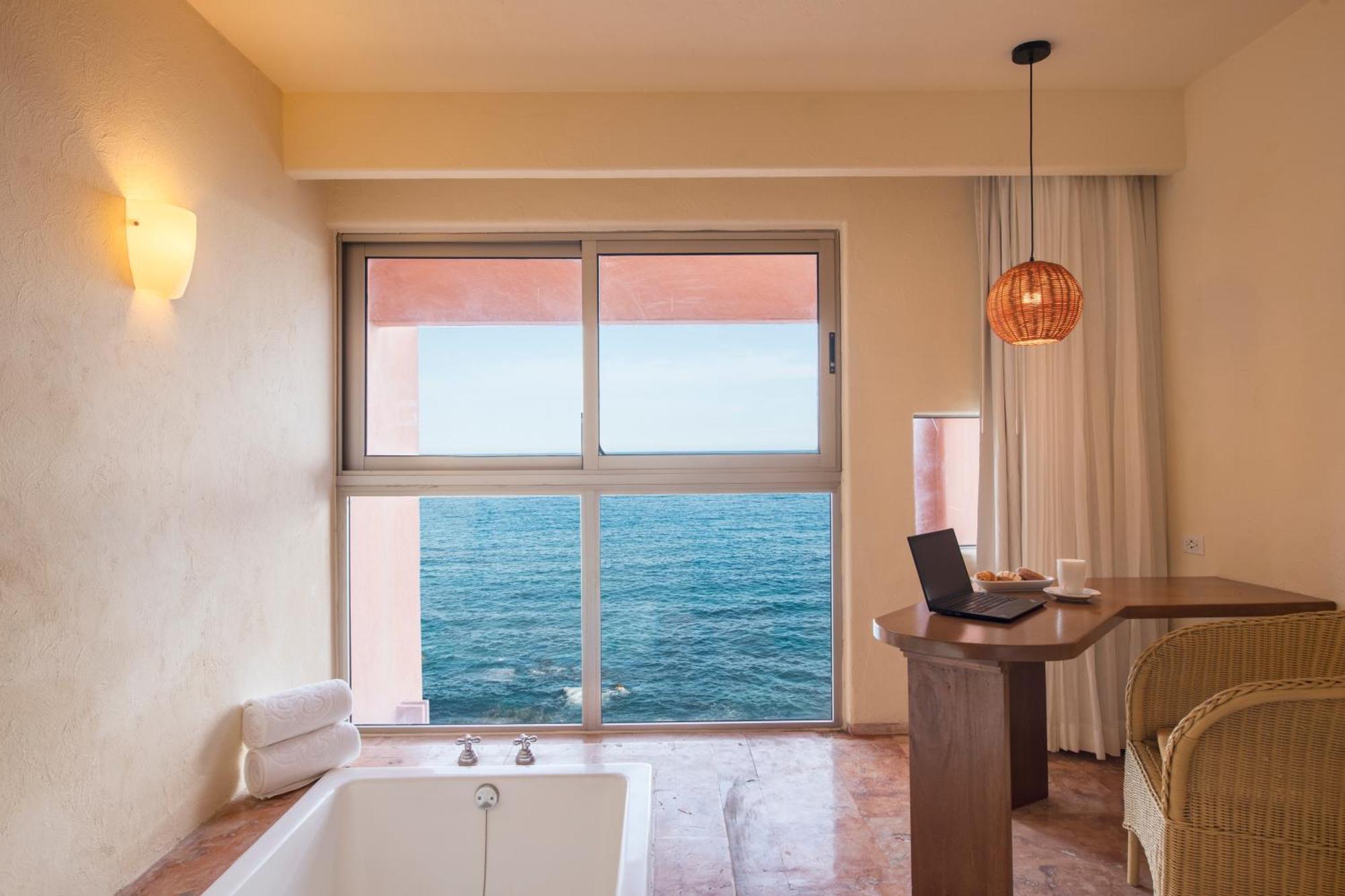 Two-Bedroom Deluxe King Suite with Jacuzzi, Terrace and Partial Ocean View